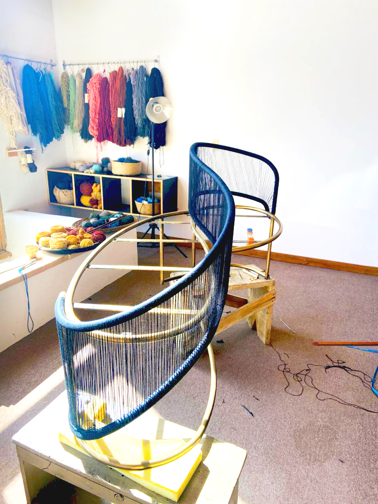 Demonstration of bench being waved with colorful threads